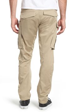 Stretch-cotton pants in a tapered profile rock a modern, utilitarian look with cargo-style pockets and ergonomic seaming for a more active fit. 32" inseam; 14" leg opening; 10" front rise; 15" back rise (size 32) Zip fly with button closure Side slant pockets; back flap pockets; side cargo pockets 97% cotton, 3% elastane Machine wash, dry flat Imported Utility Cotton Cargo Pants For Outdoor Activities, Cotton Tapered Leg Cargo Pants With Multiple Pockets, Cotton Cargo Pants With Multiple Pockets And Tapered Leg, Cotton Cargo Jeans With Multiple Pockets For Outdoor Activities, Cotton Cargo Jeans For Outdoor Activities, Outdoor Tapered Leg Cargo Jeans With Pockets, Cotton Cargo Pants With Multiple Pockets For Outdoor Activities, Outdoor Tapered Leg Cargo Jeans, Cotton Cargo Pants With Side Pockets For Outdoor Activities