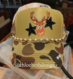 The deer patch can be replaced with other animals such as birds, etc.  Please not that this hat is made to order and we do not keep this patch on hand. Once you order, we will order the patch from our supplier. We ask that you kindly be patient:) Hat chains are removable with clasps on each end. They can be bought separate or with the hat. Please allow up to 2 weeks for this hat to ship as this is a pre-order item.  $10-$12 chain options do not include hats.  $40-$50 bling hat options do include Boujee Hippie, Truckers Hats, Hat Chain, Bling Hat, Hippie Hat, Hat Bar, Hat Patch, Blue Desk, Hunting Girls