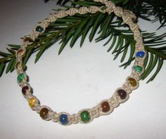 "This hemp choker necklace is created using a spiral and square knot weave embellished with tiny beads with \"stone-like\" colors of Picasso Czech glass. The necklace is finished with a bead and loop closure. Great for every day wearing:) Great Gift idea!💕 65" Hemp Choker, Hemp Jewelry, Hemp Necklace, Mini Macrame, Tiny Beads, Square Knot, Knot Necklace, Choker Necklaces, Glass Bead Necklace