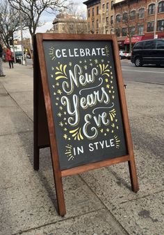 a sign that says celebrate new year's eve in style on the side of a street