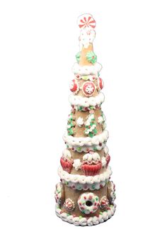 a christmas tree made out of cupcakes and other decorations on a white background