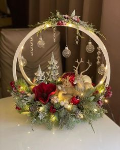 a christmas centerpiece with ornaments and lights