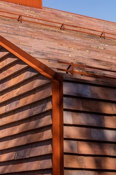 the roof of a building with wooden shingles