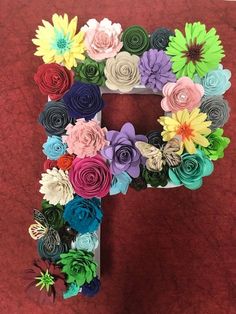 the letter f is made out of paper flowers