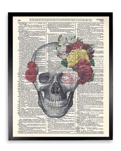 a skull with flowers on it's head sitting on an old dictionary book page