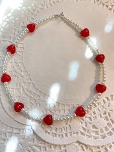 Introducing the Amorette necklace!❤️ This necklace is made with size 5mm acrylic pearls, along with red heart glass beads! Necklace is 16 inches long If you have any questions please feel free to message me! Thank you for supporting my small business!❤️ Necklaces From Beads, Beaded Heart Shirt, Red Heart Beads Necklace, Beads Necklace Ideas, Heart With Beads, Pulseras Ideas, Heart Beaded Necklace, Valentines Day Necklace, Craft Necklace