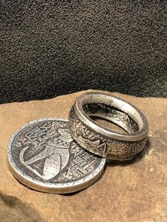 This Egyptian .999 Pure Silver Round Half Double Sided Coin Ring Is Hand Crafted with Great care and detail. This Awesome item is very unique and each individual Ring will be different due to the Crafting process. Please contact us with your preferred finish in the remarks of your order- either Antiqued Patina or High Silver Polish. We also offer this ring in sizes 6 to 12; which you can choose as you are completing your purchase. This Collectable is Silver It will not cause discoloration; Howev Unique Stamped Antique Silver Rings, Silver Etched Round Ring, Unique Engraved Ring For Collectible, Unique Engraved Round Ring, Antique Silver Hallmarked Engraved Ring, Silver Stamped Rings, Artisan Engraved Hallmarked Ring, Egyptian Cat, Fingernail Polish