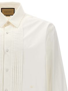 Cotton shirt with pleated plastron, button closure, long cuffed sleeves. Composition: 100% cotton Gucci Cotton Shirt For Work, Gucci Cotton Shirt For Workwear, Gucci Button-up Shirt For Spring, Spring Gucci Button-up Shirt, Gucci Spring Button-up Shirt, Gucci Tops For Work With Button Closure, Designer Long Sleeve Dress Shirt For Work, Gucci Spread Collar Shirt For Work, Elegant Gucci Button-up Shirt