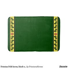 a green place mat with yellow trimmings on the edge and an image of a frog