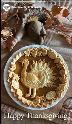 a thanksgiving pie with an image of a dinosaur on it