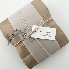 a package wrapped in brown paper and tied with twine