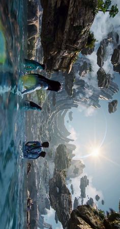 three people are standing in the water with their surfboards near some rocks and trees