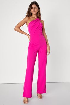 The party doesn't start until you strut in flaunting the Lulus Devoted to Fun Hot Pink One-Shoulder Sleeveless Jumpsuit! It's easy to strut in this eye-catching jumpsuit thanks to its slightly stretchy crepe knit composition that shapes a one-shoulder neckline with flattering pleating atop a sleeveless bodice. High, fitted waist sits atop straight pant legs that end at ankle-length hems. Hidden back zipper/clasp. Fit: This garment fits true to size. Length: Floor length. Size medium measures 61" from shoulder to hem. Inseam: 31.00 Front Rise: 13.00 Bust: Great for any cup size. Waist: Fitted - very fitted at natural waist. Hip: Loosely Fitted. Undergarments: May be worn with a strapless bra, adhesive bra, petals, or no bra. Fabric: Fabric has some stretch. Lined. Shell: 95% Polyester, 5% S Pink Jumpsuits Outfit, Buisness Attire, Pink Suits Women, Hot Pink Jumpsuit, Pageant Interview Outfit, Jumpsuit Wedding Guest, Hot Pink Jumpsuits, Pageant Interview, Pleated Jumpsuit