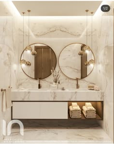 a bathroom with two round mirrors above the sink