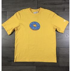 Adidas Originals X The Simpsons Donut Doh Collab T-Shirt Yellow | Men Size Small New Blue Adidas T-shirt For Streetwear, Adidas Blue T-shirt For Streetwear, Yellow T-shirt With Logo Print In Relaxed Fit, Relaxed Fit Yellow T-shirt With Logo Print, Yellow Relaxed Fit T-shirt With Logo Print, Yellow Adidas Sporty Top, Adidas Yellow Sporty Top, Sporty Yellow Adidas Tops, Yellow Adidas Crew Neck Top