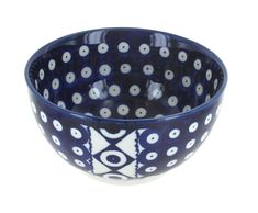 a blue and white bowl sitting on top of a table