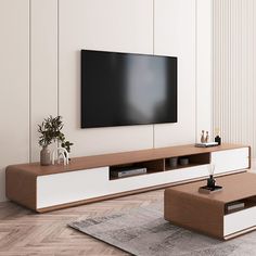 a living room with a large flat screen tv mounted on the wall next to a coffee table