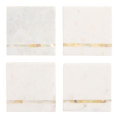 four pieces of white marble with gold stripes