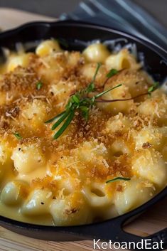 macaroni and cheese with parmesan sprinkles in a cast iron skillet