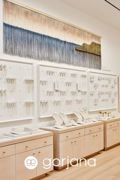 an image of a jewelry store setting with wooden cabinets and wall hangings in the background