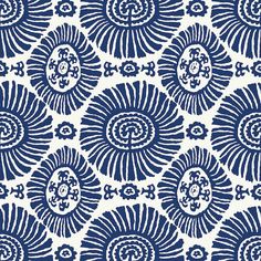 a blue and white wallpaper with an intricate design