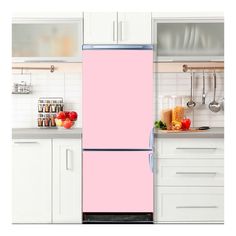 a pink refrigerator freezer sitting inside of a kitchen next to white cabinets and counter tops