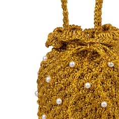 DESCRIPTION A Suryo classic. This crochet bucket has a cluster of handwoven acrylic pearls throughout the body to give it that extra va va voom! This style has a drawstring with acrylic pearl and glass beads, to keep your goodies safe. Fully lined in signature Suryo Batik. COLOUR Gold (Very very gold!) COMPOSITION Body: 100% metallic yarn- Embellishments: acryllic pearls - Lining: 100% cotton SIZE & FIT Height Including handle 30cm Diameter 16cm SHIPPING Shipping fees are based on the total weig Gold Pouch Bucket Bag As Gift, Gold Pouch Bucket Bag Gift, Elegant Gold Pouch Bucket Bag, Luxury Gold Woven Bag, Elegant Gold Bucket Bag As Gift, Gold Handwoven Bag Gift, Gold Handwoven Bag As A Gift, Gold Handwoven Bags As Gifts, Chic Gold Handwoven Crochet Bag