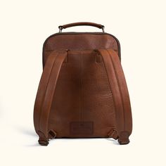 We aimed for the spirit of Roosevelt, of action and purpose, into our new commuter backpack. Crafted from the untamed strength and character of rich full grains of buffalo leather which epitomizes durability and rugged luxurious style. Within its soft but sturdy construction, this backpack unveils a multitude of compartments meticulously designed to accommodate your every need. From safeguarding your laptop (up to 15") with a cushioned section, to providing a secure space for your iPad, notebook Leather Backpack For On-the-go, Travel Leather Backpack With Vegetable Tanned Leather, Travel Leather Backpack With Vegetable-tanned Leather, Daily Backpack With Leather Backing In Vegetable Tanned Leather, Functional Leather Backpack With Leather Handles, On-the-go Leather Backpack, On-the-go Smooth Grain Leather Backpack, Travel Backpack With Vegetable Tanned Leather And Leather Lining, Everyday Leather Backpack In Vegetable Tanned Leather