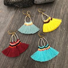 Fun light and easy to wear tassel earrings. Made with a teardrop brass base and unique mix of colorful tassels. You can choose from 4 different pairs that are in different colors. 4 unique pairs that will rock your day by day outfits. You can choose between the bright blue, light blue, yellow and burgundy. The earrings are 4.6cm- 1.90 inch long 3.6cm- 1.5 inch wide (where the tassels are) They have a drop length of 5.5cm- 2.25 inch A most have addition to your jewelry collection, To see more uni Trendy Dangle Tassel Earrings For Festivals, Trendy Tassel Dangle Earrings For Festival, Fringe Drop Tassel Earrings As Gift, Festival Dangle Tassel Earrings With Ear Wire, Fringe Tassel Drop Earrings As Gift, Trendy Tassel Drop Earrings, Gift Tassel Drop Earrings With Fringe, Trendy Fringe Tassel Earrings For Festivals, Trendy Tassel Drop Earrings With Fringe