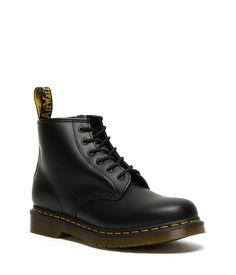 The Dr. Martens® 101 Yellow Stitch boots embodies all the classic clean lines, standout stitching, and edgy attitude of the vintage utilitarian work boot, but in a lower-cut design and a smooth leather construction..Lace-up boots have a smooth leather construction made of a firm, finished leather with a smooth, semi-bright appearance..Six-eyelet boot with sturdy fabric laces for a secure fit..Features classic Doc's DNA including grooved edges, a yellow welt stitch, and a scripted heel loop..Goodyear® welt provides both durability and flexibility..Breathable textile lining..Cushioned insole for long-lasting underfoot support..Air-cushioned rubber outsole is oil, fat, acid, petrol, alkaline resistant and has excellent slip and abrasion resistance..Imported..Product measurements were taken us Chukka Boots With Reinforced Heel For Workwear In Fall, Fall Chukka Boots With Reinforced Heel For Work, Classic Moto Boots With Reinforced Toe For Work, Classic Waterproof Boots With Reinforced Toe For Streetwear, Classic Combat Boots With Steel Toe For Streetwear, Fall Streetwear Boots With Plain Toe, Classic Workwear Boots With Reinforced Toe, Classic Waterproof Boots For Winter Workwear, Plain Toe Boots For Fall Streetwear