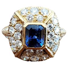 This listing is for an estate 18k yellow gold diamond and sapphire high end designer ring. It has approx. 1.50tcw white VS flush set round brilliant diamonds with a 1.10ct super clean and vibrant emerald cut blue sapphire center stone. The color is royal blue. This piece is in like new condition, make it yours. Approx. size 6 Timeless Luxury Yellow Gold Sapphire Ring, Estate Rings Vintage, Butterfly Diamond Ring, Opal Diamond Ring, Diamond Cluster Engagement Ring, Estate Rings, Vintage Sapphire, Modern Engagement Rings, Cluster Engagement Ring