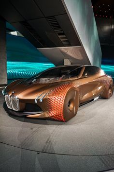 a futuristic car on display in a building