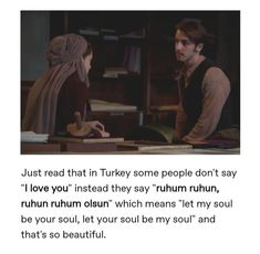 a man and woman sitting at a table in front of each other with the caption'just read that turkey some people don't say i love you instead they say