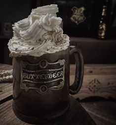 a chocolate mug with whipped cream on top