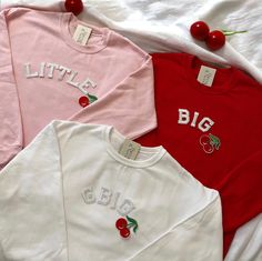 These cute Cherry Coquette Big Little Sorority Sweatshirts are great for Big Little Reveal! They are perfect to give to your big/lil as a gift and match outfits with! <3  - These letters are iron-on patched and is heat pressed, not embroidered. Rest assured the won't come off! - You have to purchase the sweatshirts individually. - All our sweatshirts run a Unisex fit. They are naturally oversized, but if you like a more baggy look, we recommend sizing up. - Material is super soft and comfy! ♡ - Lil So Sweet Soroity Reveal, Cute Long Sleeve T-shirt With Embroidered Text, Cute College Tops For Fall, Cute Spring College Tops, Cute Tops For College In Spring, Cute White College Tops, Cute White Tops For College, Cute Long Sleeve College T-shirt, Pink Long Sleeve Top With Letter Embroidery