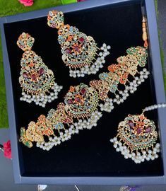 Pakistani made beautiful Navratna choker set is in style now... Grab it now it's a best deal ever. Multicolor Jewelry With Intricate Design For Party, Hand Set Bridal Choker Necklace For Celebration, Hand Set Bridal Choker For Celebration, Festive Choker Necklace For Weddings, Party Choker With Intricate Design, Hand-set Bridal Choker Necklace For Celebration, Festive Wedding Choker Necklaces, Festive Wedding Choker Necklace, Elegant Wedding Sets With Choker