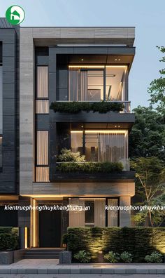 an apartment building with plants growing on the balconies and windows that are lit up at night