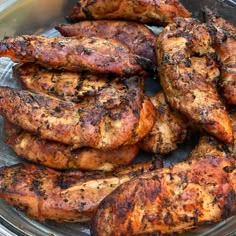 grilled chicken wings in a bowl on a table