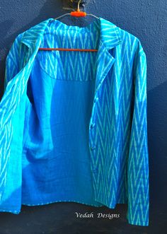 This is a Aqua blue Ikat cotton Jacket/ Blazer most suitable for all occasions. It can be clubbed with a pair of Jeans or skirts with inner tube/ tank top. It has a very soft voile lining inside (shown in Pic 5).   Free size ------- fits small to medium Handfeel --------- Soft Medium Ikkat Jackets For Women, Summer Cotton Long Sleeve Blazer, Summer Cotton Blazer With Long Sleeves, Ikkat Coats For Women, Summer Cotton Blazer In Blue, Summer Blue Cotton Blazer, Blue Cotton Blazer, Summer Cotton Blue Blazer, Luxury Ikat Print Traditional Wear For Women