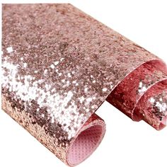 the pink and silver glitter rug is rolled up