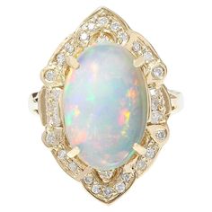 9.05 Carat Natural Opal 14K Solid Yellow Gold Diamond Ring Item Type: Ring Item Style: Cocktail Material: 14K Yellow Gold Mainstone: Opal Stone Color: Multicolor Stone Weight: 8.25 Carat Stone Shape: Oval Stone Quantity: 1 Stone Dimensions: 15.00x10.00 mm Stone Creation Method: Natural Stone Treatment Method: Not-treated Gemstone 1: Diamond Stone Color: F-G Stone Clarity: VS2-SI1 Stone Weight: 0.80 Carat Stone Shape: Round Stone Creation Method: Natural Stone Treatment Method: Not-treated Total Opal Diamond Ring, Opal Birthstone, Yellow Gold Diamond Ring, Gold Diamond Ring, Yellow Gold Engagement Rings, La Face, Lovely Ring, Opal Stone, Oval Stone