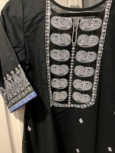 Beautiful Pakistani/Indian kurti by khaadi in black with white embroidery and prints. Black Cotton Salwar Kameez For Eid, Eid Black Cotton Salwar Kameez, Straight Kurta With Motifs For Navratri, Navratri Straight Kurta With Motifs, Black Anarkali Traditional Wear, Bollywood Style Straight Kurta With Motifs, Eid Kurta With Traditional Patterns In Mulmul, Black Anarkali Kurta With Dabka, Black Anarkali Traditional Cotton Wear