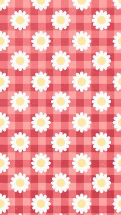 a red and white checkered table cloth with daisies on it