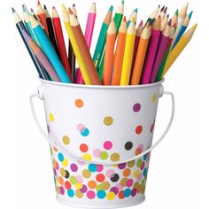 a bucket full of colored pencils sitting on top of a white table with polka dots