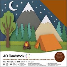 a paper cut out of a camping scene with trees, tent and campfire in the foreground