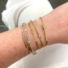 We love this dainty cuff with the perfect pop of sparkle! Modern Hand Set Diamond Bracelet, Bezel Set Diamond Bangle Bracelet, Dainty Stackable Bangle, Dainty Hand Set Diamond Bracelet, Adjustable Single Cut Diamond Bracelet, Dainty Single Diamond Bangle Bracelet, Dainty Bangle Bracelet With Single Diamond, 14k Gold Stackable Cuff Bracelet, Elegant Cuff Bracelet With Single Diamond Gift