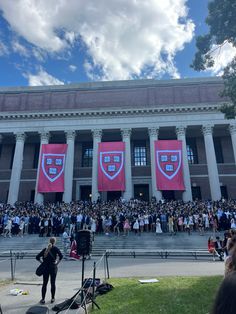 a large group of people standing in front of a building