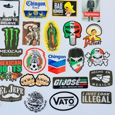 many different stickers and decals on a white surface, including one for mexico