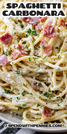 spaghetti carbonara with bacon and parmesan cheese in a white bowl on a checkered table cloth