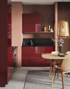 a modern kitchen with red cabinets and white counter tops, including a round dining table